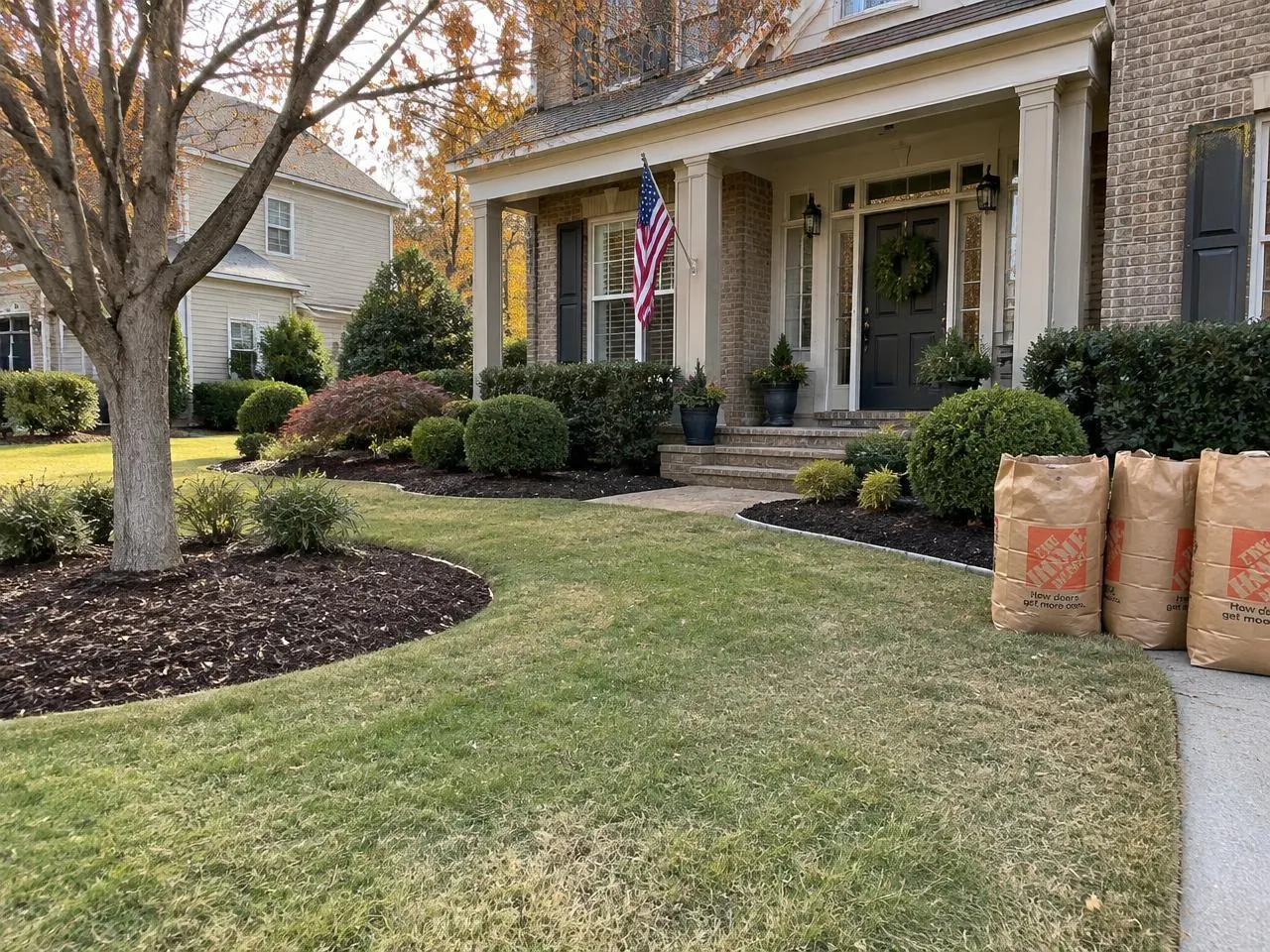Trimmed shrubs and a fresh flower bed after a spring clean-up
